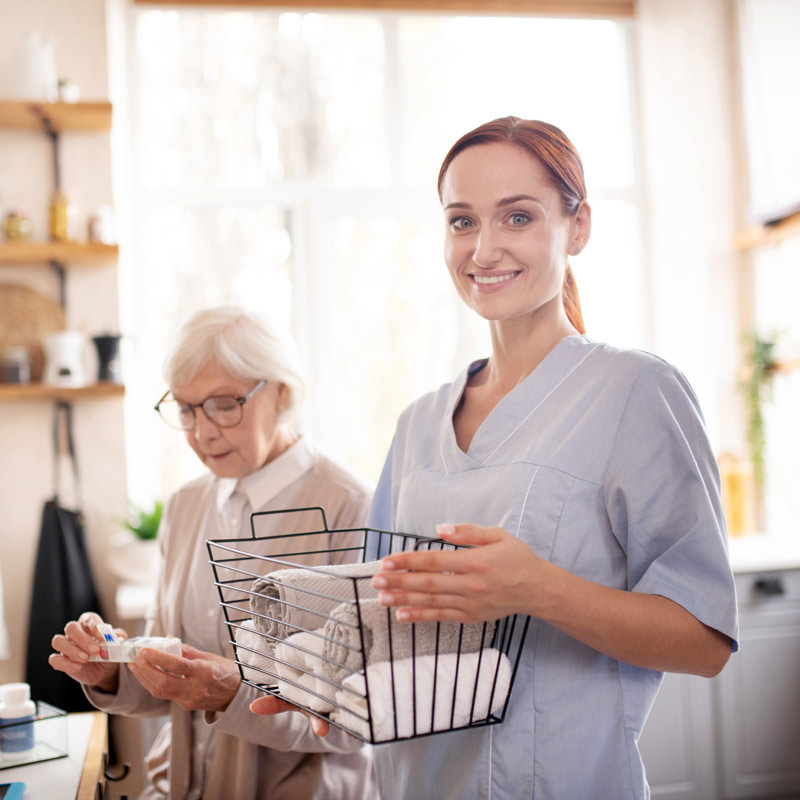 nurse helping female patient